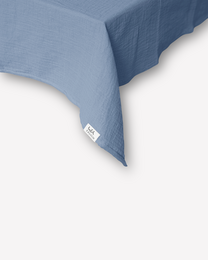 Dusty blue muslin tablecloth, soft cotton material, square shape, elegant table decor
