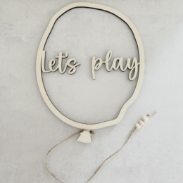  Wooden wall decor with the text "Let's play" in a circular frame, featuring wooden balloon shapes in various sizes.