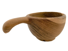  A wooden baby cup with a handle, suitable for holding liquids or small items. The cup has a simple, natural design.
