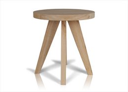  Large round natural wood side table with three angled legs.