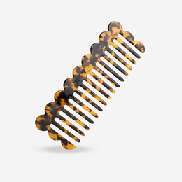 Dark cheetah patterned comb with black and amber-colored bristles.