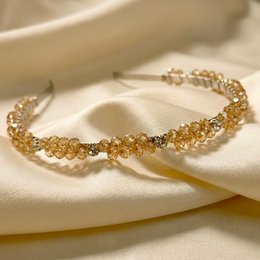 Gold crystal beaded headband, bridal hair accessory, sparkly twisted design, elegant wedding hairpiece.