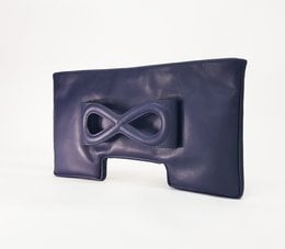 Navy blue leather clutch with infinity symbol design.