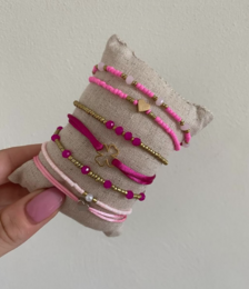  Satin cord bracelets in brown, beige, and green colors. The bracelets feature a simple, minimalist design with metal accents.