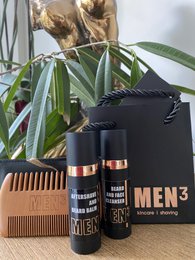 Black grooming set with beard oil and comb, ideal for men's facial hair care.
