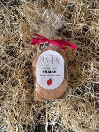 Round, soft strawberry cookies packaged in a rustic wooden container with a red ribbon.