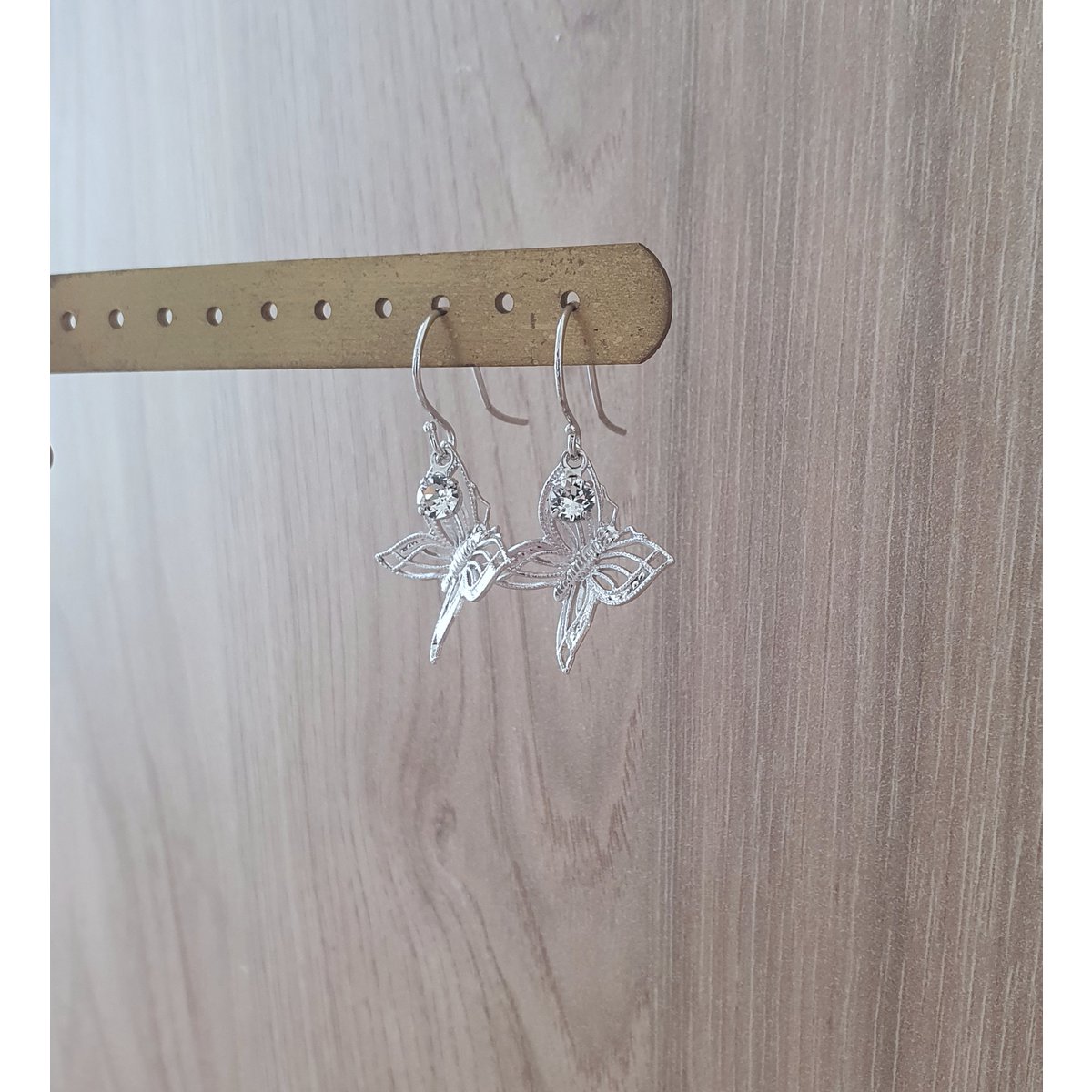 Rhodium plated butterfly earrings with charms