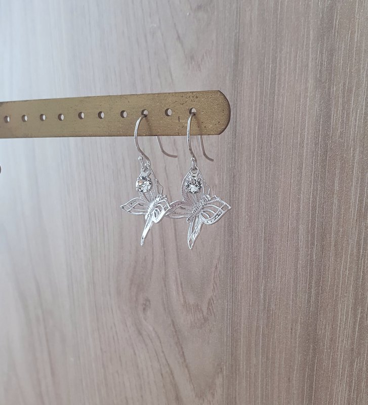 Rhodium plated butterfly earrings with charms
