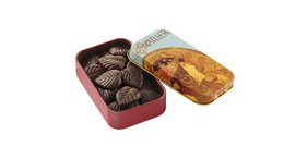Dark chocolate petals in a 30-gram tin. Rich, indulgent chocolate with a smooth, velvety texture.