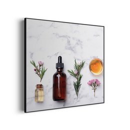 Marble square painting with essential oil bottles, flowers, and a glass of liquid. The painting features a minimalist, modern design with a marble-like background.