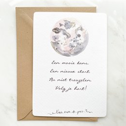 A greeting card with a watercolor illustration of a moon and handwritten French text that translates to "A new moon, a new start, a new adventure, a new life!"