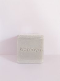 Rosemary-scented all-purpose household soap with a rectangular shape and white color.