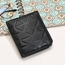 Luxury black napa leather wallet with slim croc design, featuring a coin pocket and card slots. Compact and stylish for everyday use.