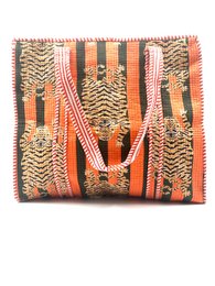 Orange striped woven tote bag with geometric patterns, natural fibers, large capacity handbag.