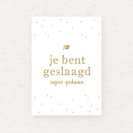 Gold foil text card with the Dutch phrase "Je bent geslaagd" meaning "You have succeeded" or "You have graduated".