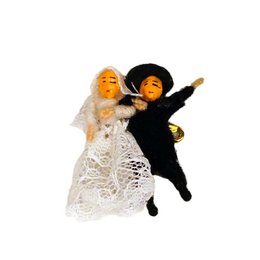  Brooch with Peruvian lucky couple, featuring a bride and groom figurine in traditional Peruvian attire. The brooch is made of metal and decorated with intricate lace-like patterns.