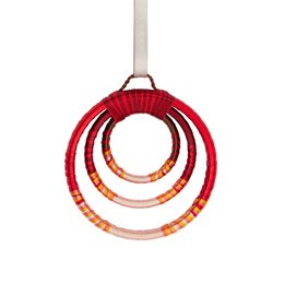 Decorative red and orange rings with a metallic frame, creating a beaming, radiant ornament.