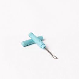 Turquoise earpick made of zero plastic, designed for life-long use in oral care.