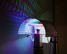 Multicolored LED light bulb with a unique, modern design. Provides vibrant, adjustable lighting for a variety of settings.