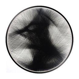 A round black and white abstract wall art piece with a diameter of 58 cm or 40 cm, featuring a striking geometric pattern.