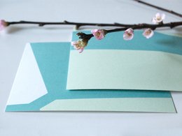 Set of pastel-colored postcards with spring blossoms design.