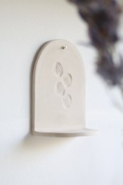 Ceramiczny wieszak ścienny ze świecą