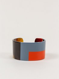 Manchette laquée orange et gris-bleu