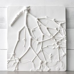 Large white relief image with abstract mistletoe design.