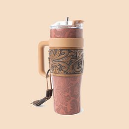 A wide, brown tumbler with a decorative pattern on the exterior.