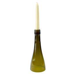 Upcycled glass bottle candlestick in a tall, slender shape with a cream-colored candle.