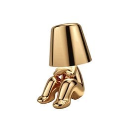 Gold table lamp with dog-shaped base, modern metallic design, decorative animal figure lighting fixture.