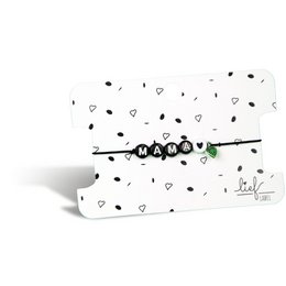 Black and white bracelet with charm, made of metal, featuring a heart-shaped charm.