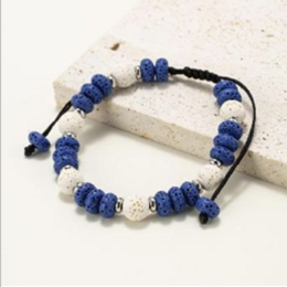Bracelets made of round and flat beads in natural lava stone dyed blue and white