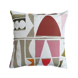This outdoor cushion features a geometric pattern with a mix of shapes and colors, including triangles, rectangles, and ovals in shades of red, pink, brown, and green. The pattern has a retro, mid-century modern aesthetic that would complement a variety of outdoor decor styles.
