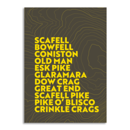 A wall art print featuring the text "SCAFELL BOWFELL CONISTON OLD MAN ESK PIKE GLAMARA GREAT END SCAFELL PIKE O' BLISCO CRINKLE CRAGS" in a bold, typographic style against a dark, textured background.