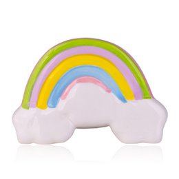  Colorful rainbow-shaped piggy bank with a magical unicorn design. Made of soft, durable materials. Ideal for saving money or as a decorative piece.