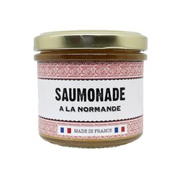  Normandy-style savory sauce in a glass jar with a pink and white patterned label. The sauce appears to be a thick, spreadable consistency, likely made from a blend of herbs and spices.