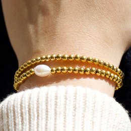 Aquilea – Armbandstapel aus Goldperlen