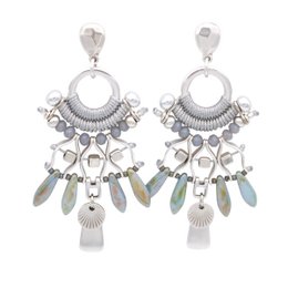 Silver-toned statement earrings with dangling charms and beads, featuring a circular design with intricate details.