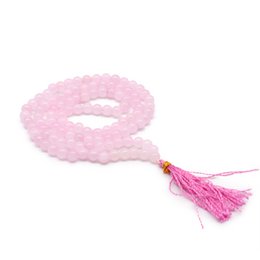 108 Bead Mala Necklace - Rose Quartz
This 108 bead mala necklace is made of rose quartz, a soft pink gemstone known for its calming and soothing properties. The necklace features a tassel accent in a vibrant pink color, adding a touch of elegance. The round, smooth beads create a classic, minimalist design suitable for everyday wear.