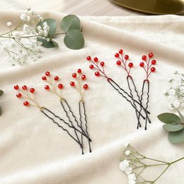 Red crystal hair pins, bridal hairstyle accessories, delicate floral design, wedding hairpiece.