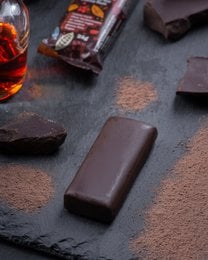 Dark chocolate bar, vegan, no added sugar, gluten free, cocoa rum flavor, individually wrapped.