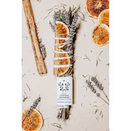 Smudge stick with lavender, rosemary, orange, and cinnamon. Earthy, aromatic incense bundle for cleansing and meditation.