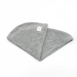 Soft, absorbent bamboo hair turban in beige, blush pink, cream, light blue, and light grey colors. Made of natural bamboo fabric for gentle hair drying.