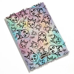 A colorful notebook cover featuring a repeating pattern of whimsical cartoon skull and cat-like characters in various pastel shades.