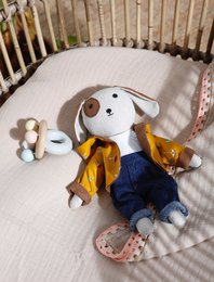 Soft, cuddly plush dog toy with navy blue pants and a yellow scarf, perfect for snuggling and playtime.