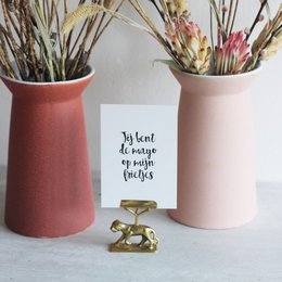 A greeting card featuring a handwritten message in black text on a white background, with a kraft paper envelope. The card appears to be part of a "Love Cards" collection.