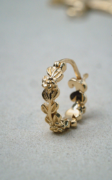 Arete flor chapado en oro 14k