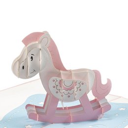 A pink and white rocking horse pop-up card with a whimsical design, suitable for greeting cards or decorative purposes.