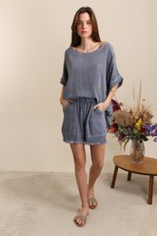 White cotton-linen blend short-sleeved top with black knee-length shorts. Available in a variety of colors including black, navy, khaki, pink, denim blue, taupe, beige, white, royal blue, teal, gray, and coral.